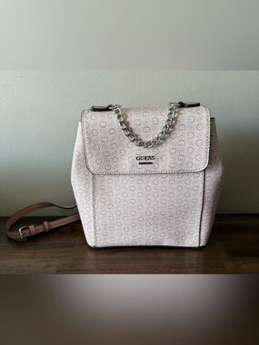GUESS Wesley mini backpack in a light rose pink.